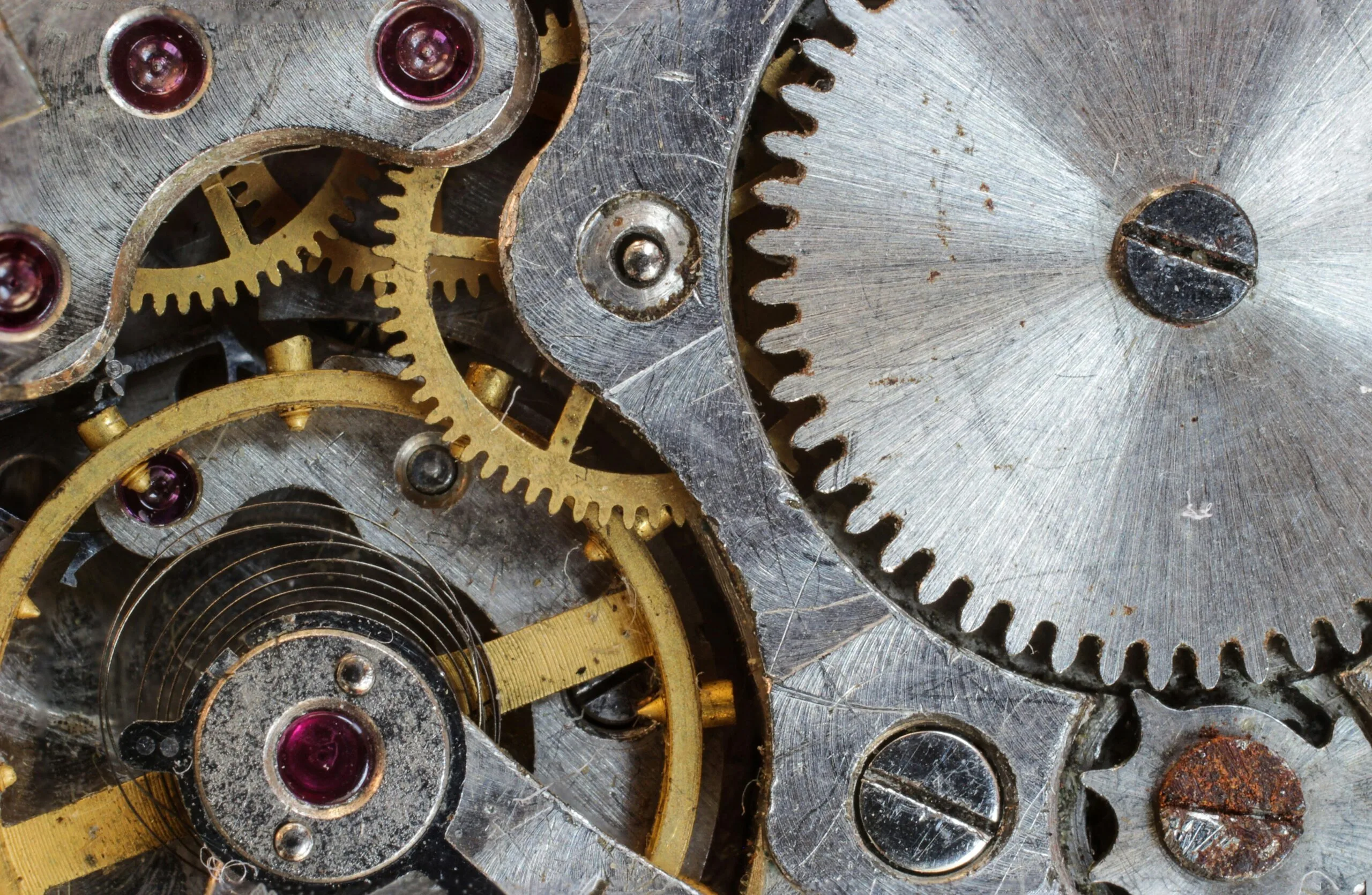 macro-focus-cogwheel-gear-159275-159275 Detailed close-up of interlocking gears and cogs in a complex mechanical system.